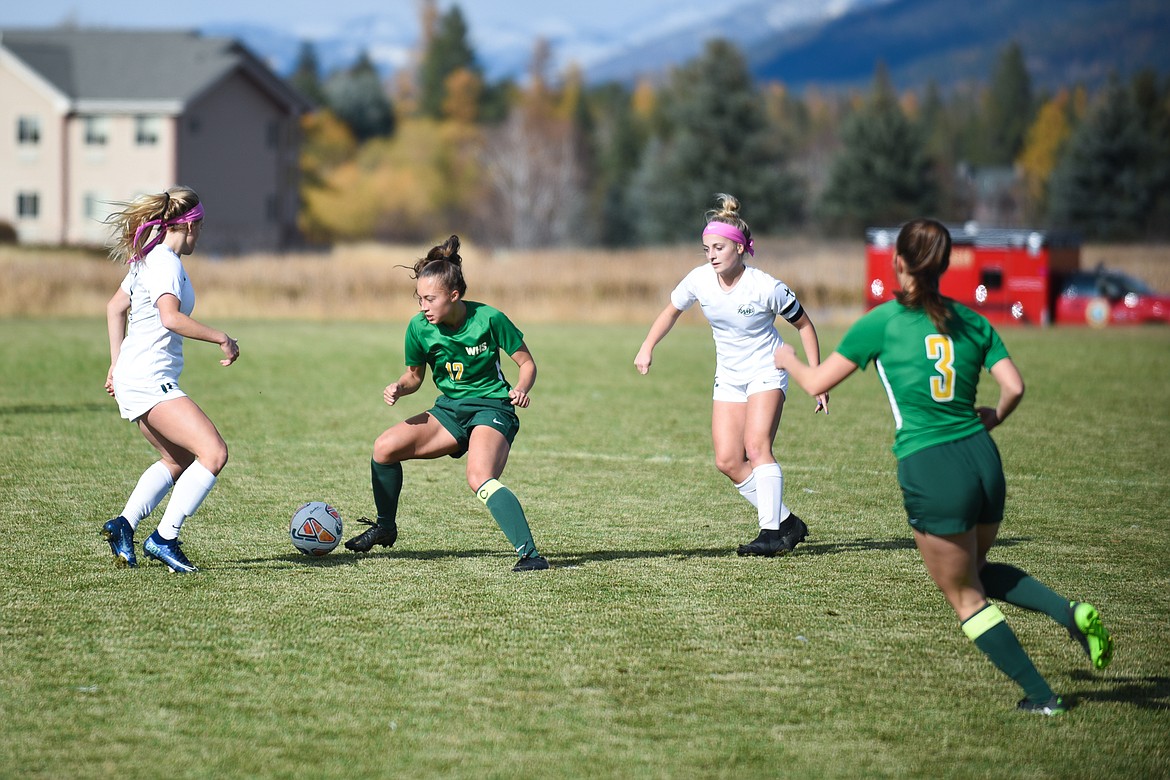 Anna Cook makes a cut in Saturday's semifinal loss to Billings Central. (Daniel McKay/Whitefish Pilot)