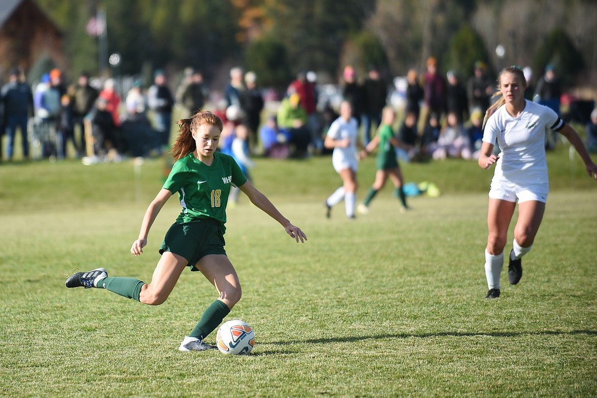 Adrienne Healy fires a pass during the Lady Dogs' home semifinal loss on Saturday. (Daniel McKay/Whitefish Pilot)