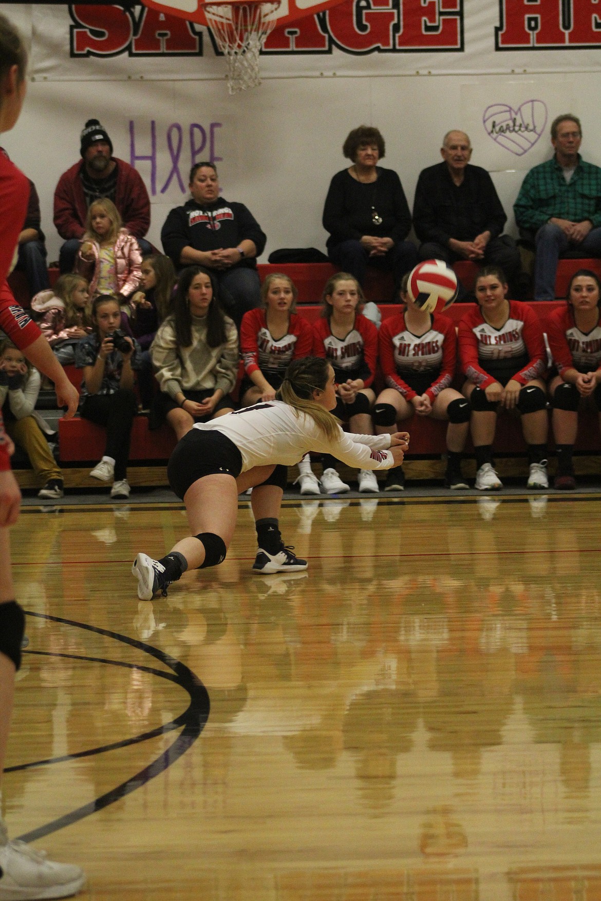 SAGE JACKSON trying to catch up to a serve from Victor last Saturday night. (John Dowd/Clark Fork Valley Press)