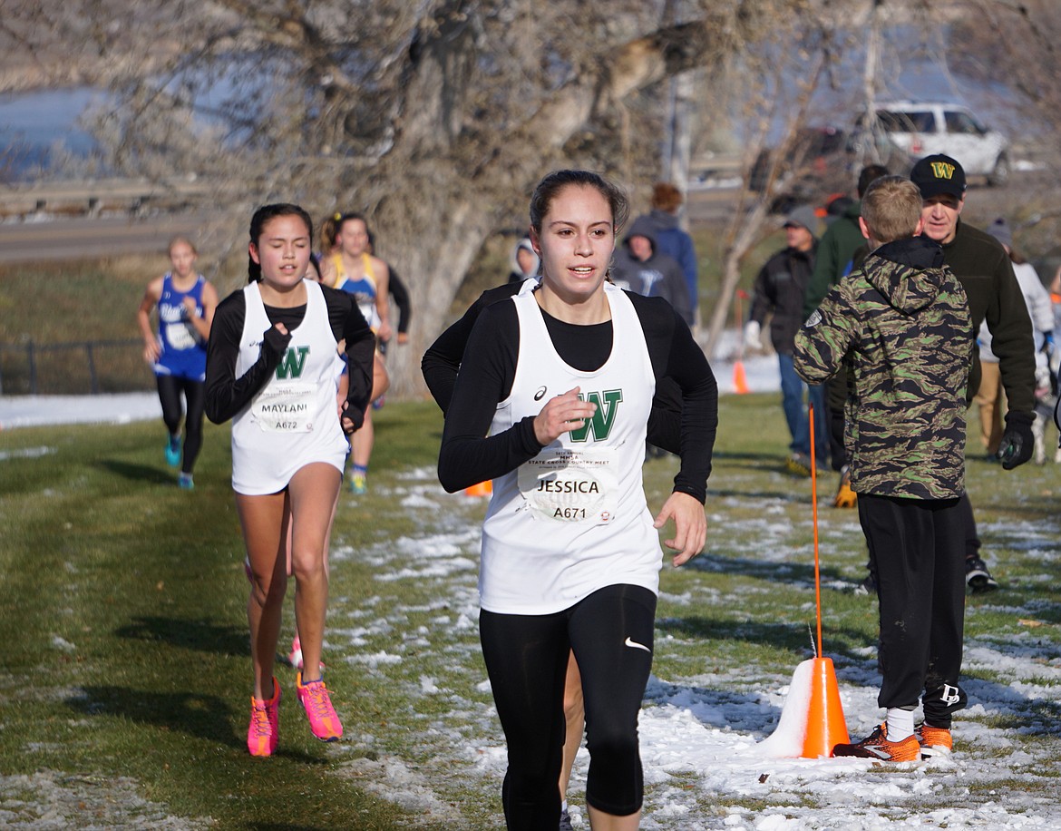 Jessica Henson leads fellow Bulldog Maylani Horton up the final hill toward the finish at the Class A State Cross Country meet in Great Falls on Saturday. Henson finished with a time of 20:52.11 and Horton finished with a time of 21:05.70. (Matt Weller photo)