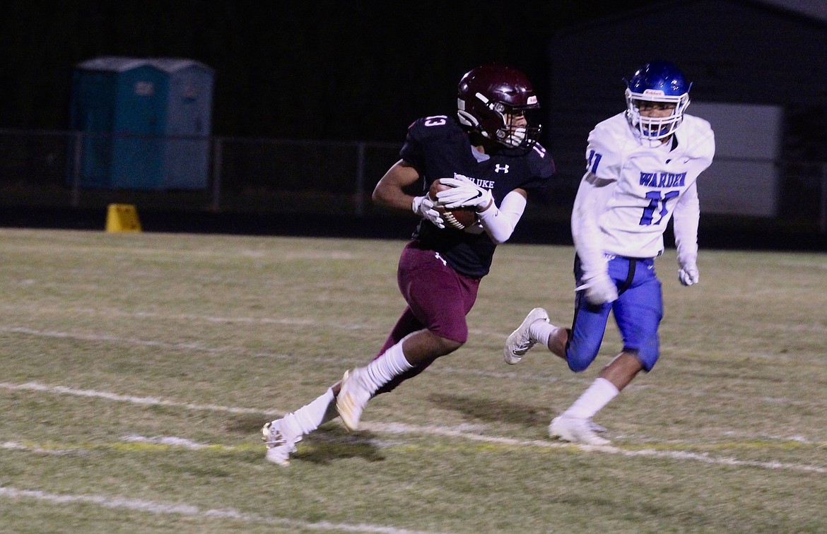 Casey McCarthy/Columbia Basin Herald Wahluke&#146;s Johny Miron cuts outside with Edgar Hernandez is in pursuit for the Cougars on Friday night.