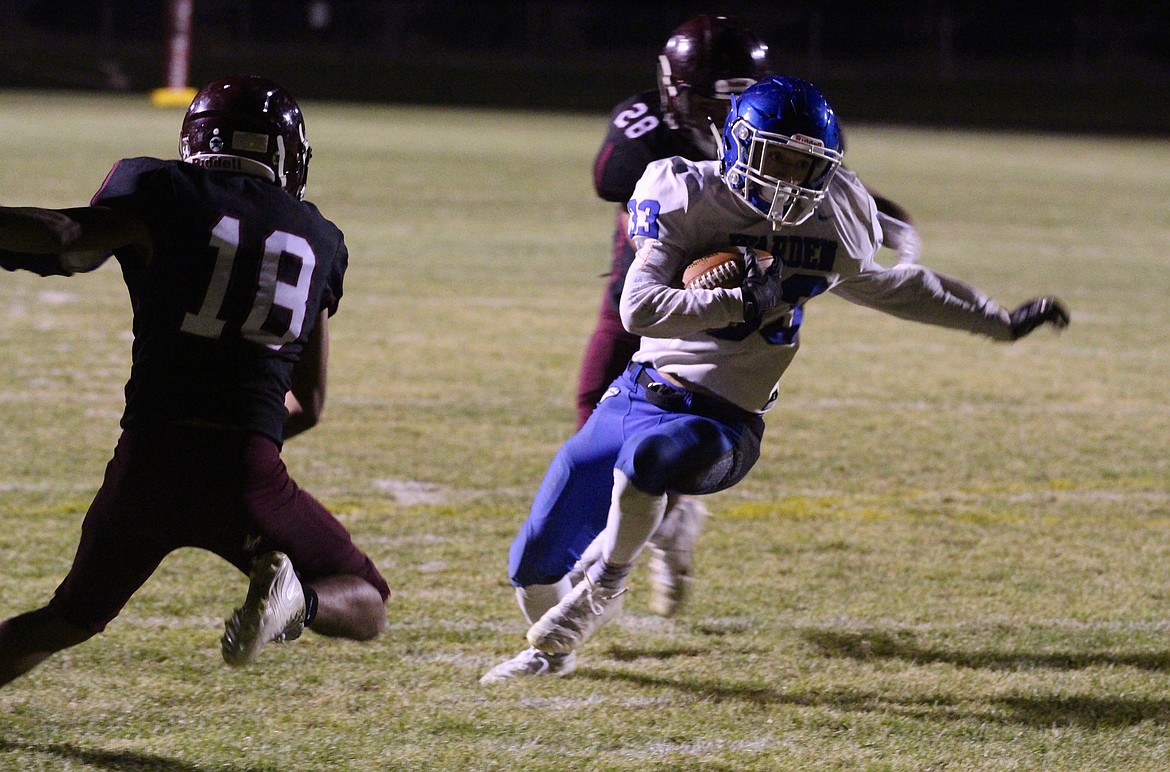 Casey McCarthy/Columbia Basin Herald Tyson Wall cuts inside for the Cougars on Friday night, scoring two rushing touchdowns for Warden in the win.