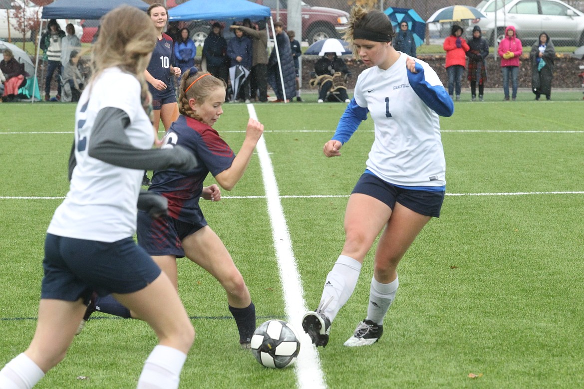 MARK NELKE/Press
Rebekah Hines of Coeur d&#146;Alene Charter challenges Alleyna Edmondson of Grangeville for the ball in the first half of Saturday&#146;s 3A District 1-2 girls soccer championship game at The Fields at Real Life Ministries in Post Falls.