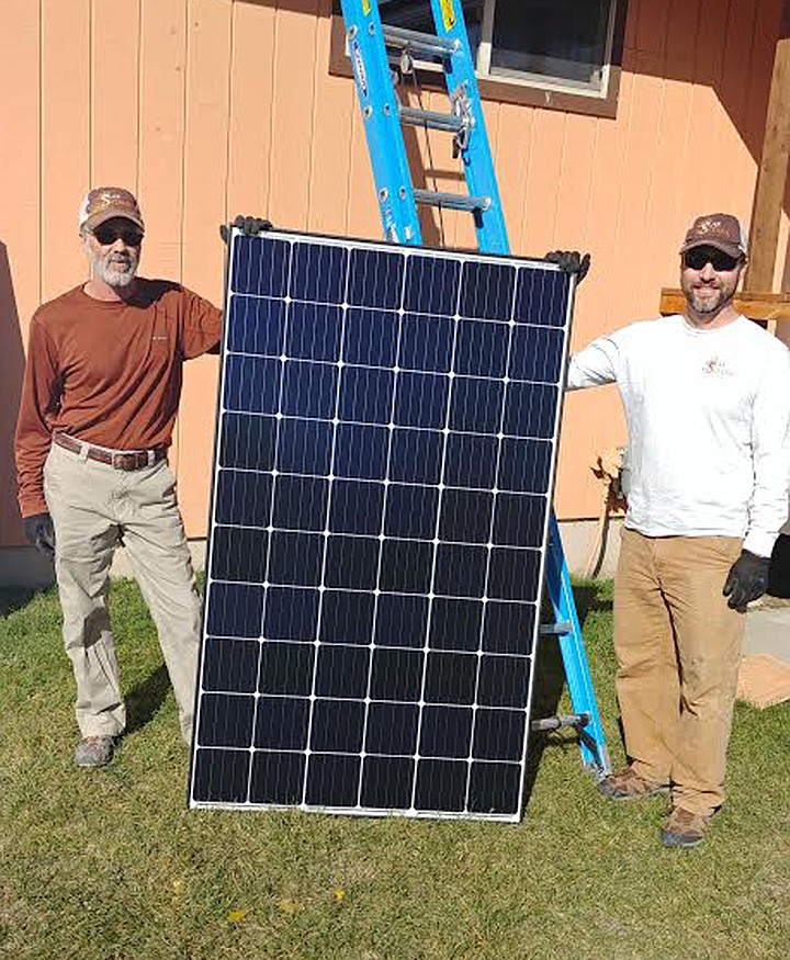 Solar Montana&#146;s Mark Whitman, left, and Jack Isbell, prepare to take solar panels to the roof of the St. Regis Community Center. (Chuck Bandel/Mineral Independent)