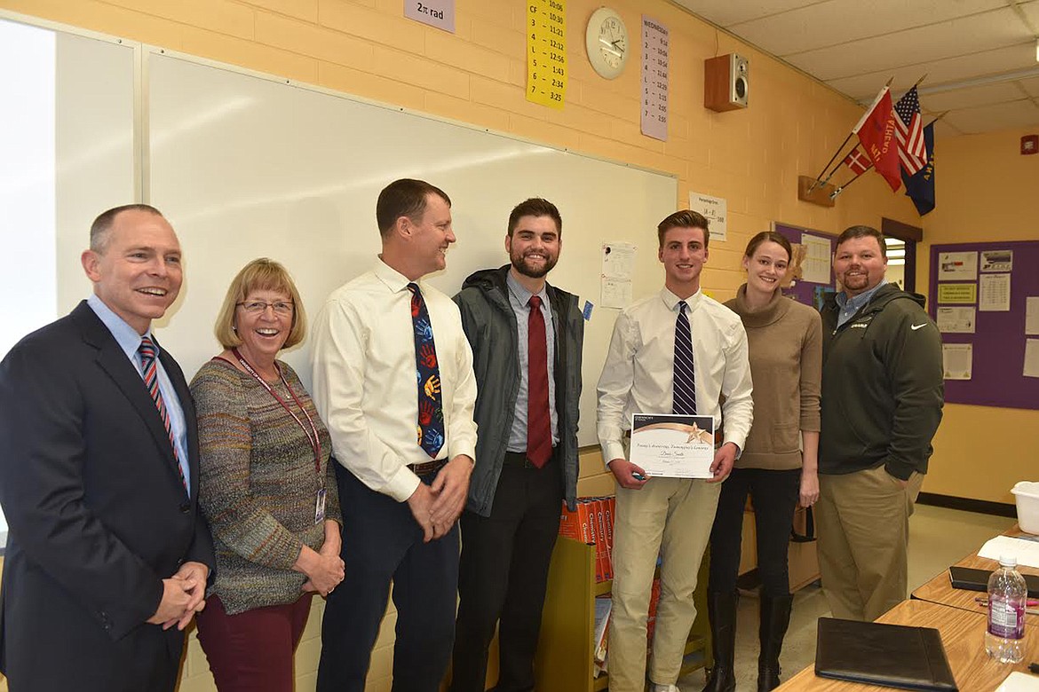 The “Today’s Achievers, Tomorrow’s Leaders” award was presented to Polson High School senior Davis Smith in a surprise ceremony Oct. 21. From left, are Kalispell Regional Healthcare CEO Craig Lambrecht, Polson High School guidance counselor Emily Johnson, Polson Superintendent of Schools Rex Weltz, Kalispell Regional Healthcare communications specialist Chris Leopold, Polson High School guidance counselor Betsy Wade and Polson High School Principal Peter Hamilton. (Carolyn Hidy/Lake County Leader)