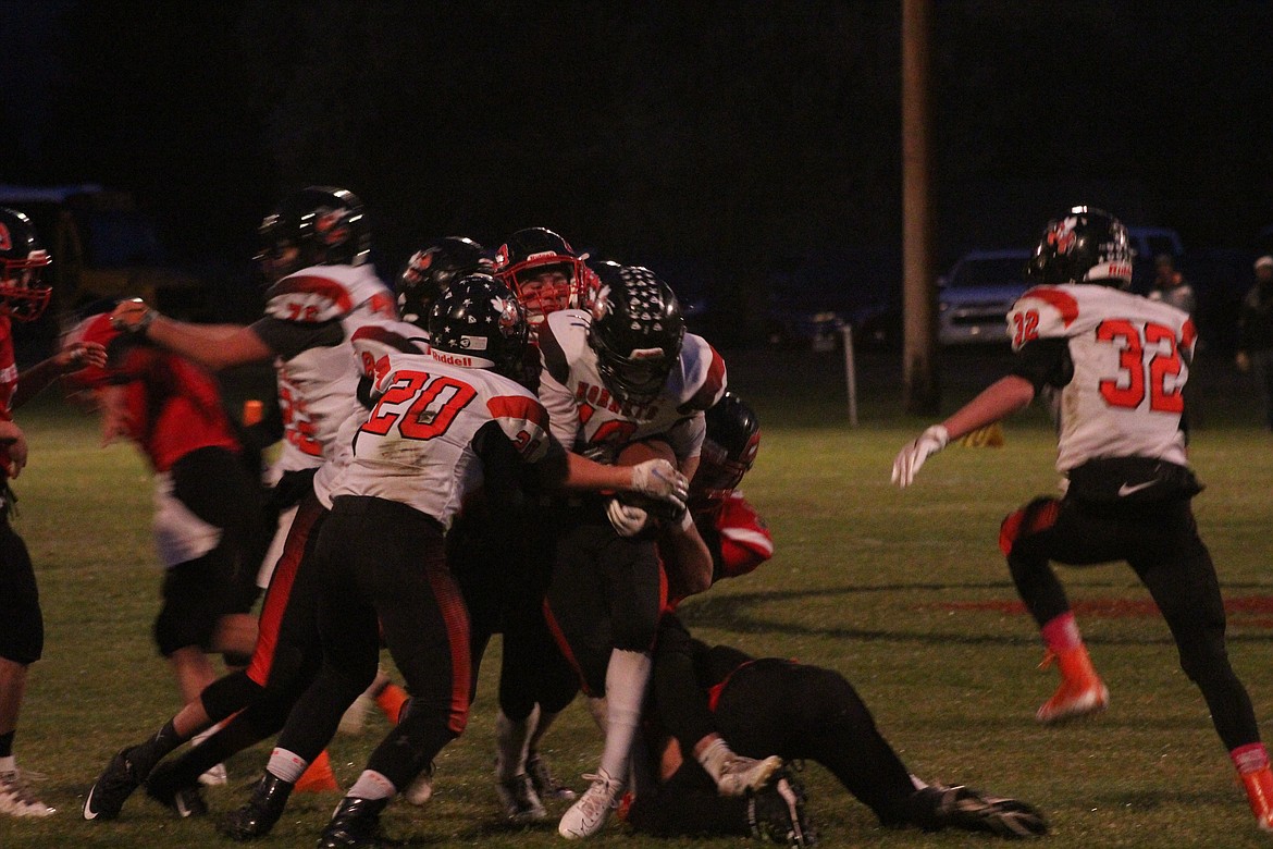 A WHOLE herd of While Sulphur Springs tacklers had to take down one Savage Heat receiver last Friday. Hot Springs came out on the winning end 44-6. (John Dowd/Clark Fork Valley Press)