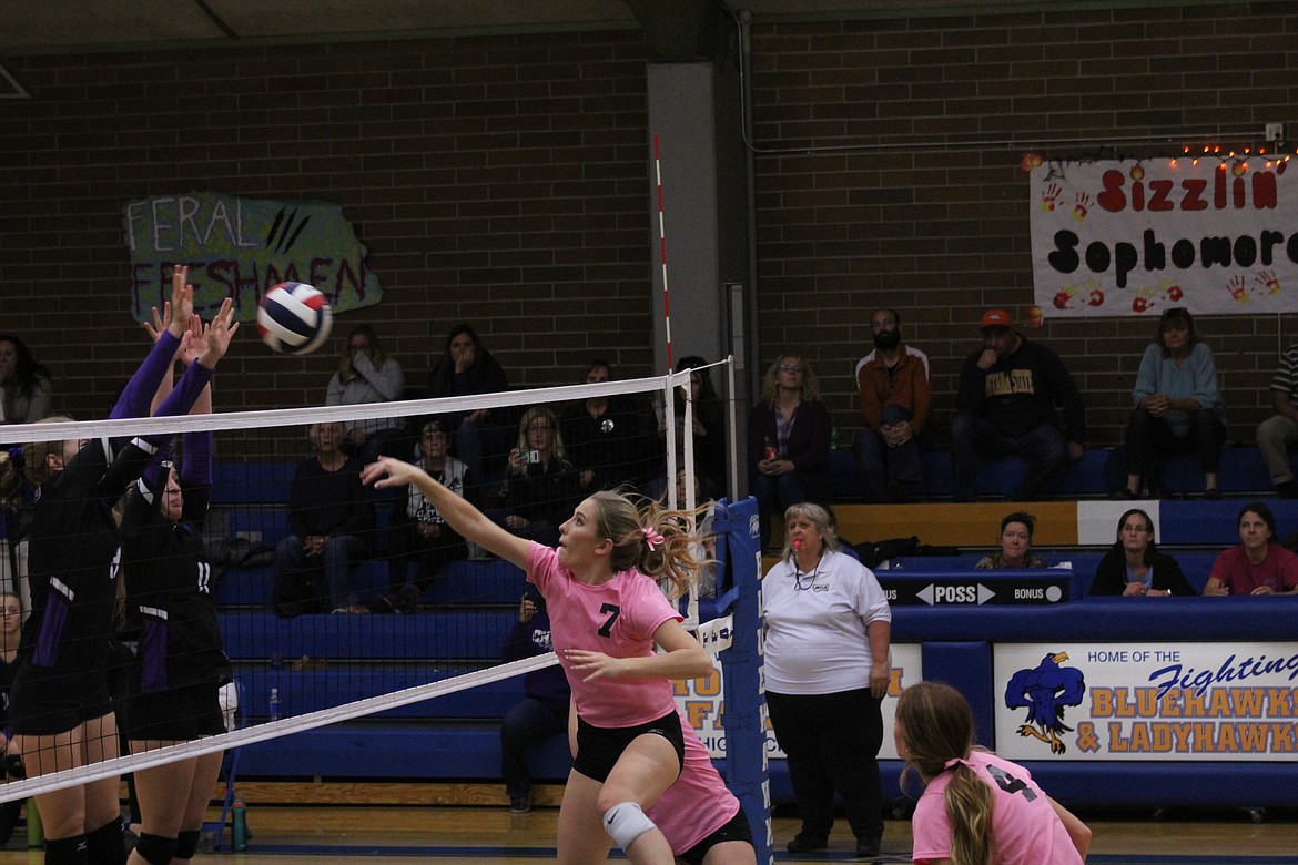 BELLE COOPER delivers a spike against Charlo. The Lady hawks came out on top, winning in four sets. (John Dowd/Clark Fork Valley Press)