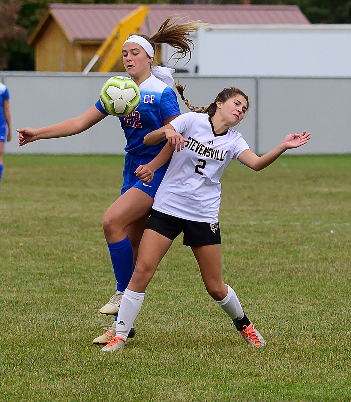 Aletheia Fisher collides with a Stevensville defender.