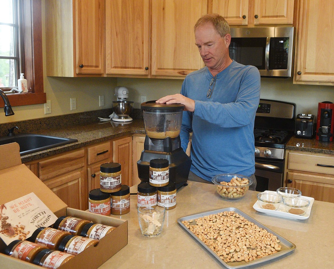 Paul Burton mixes up a batch of peanut butter in the kitchen of his Whitefish home. He has created Northwoods, an artisanal peanut butter company. (Heidi Desch/Whitefish Pilot)