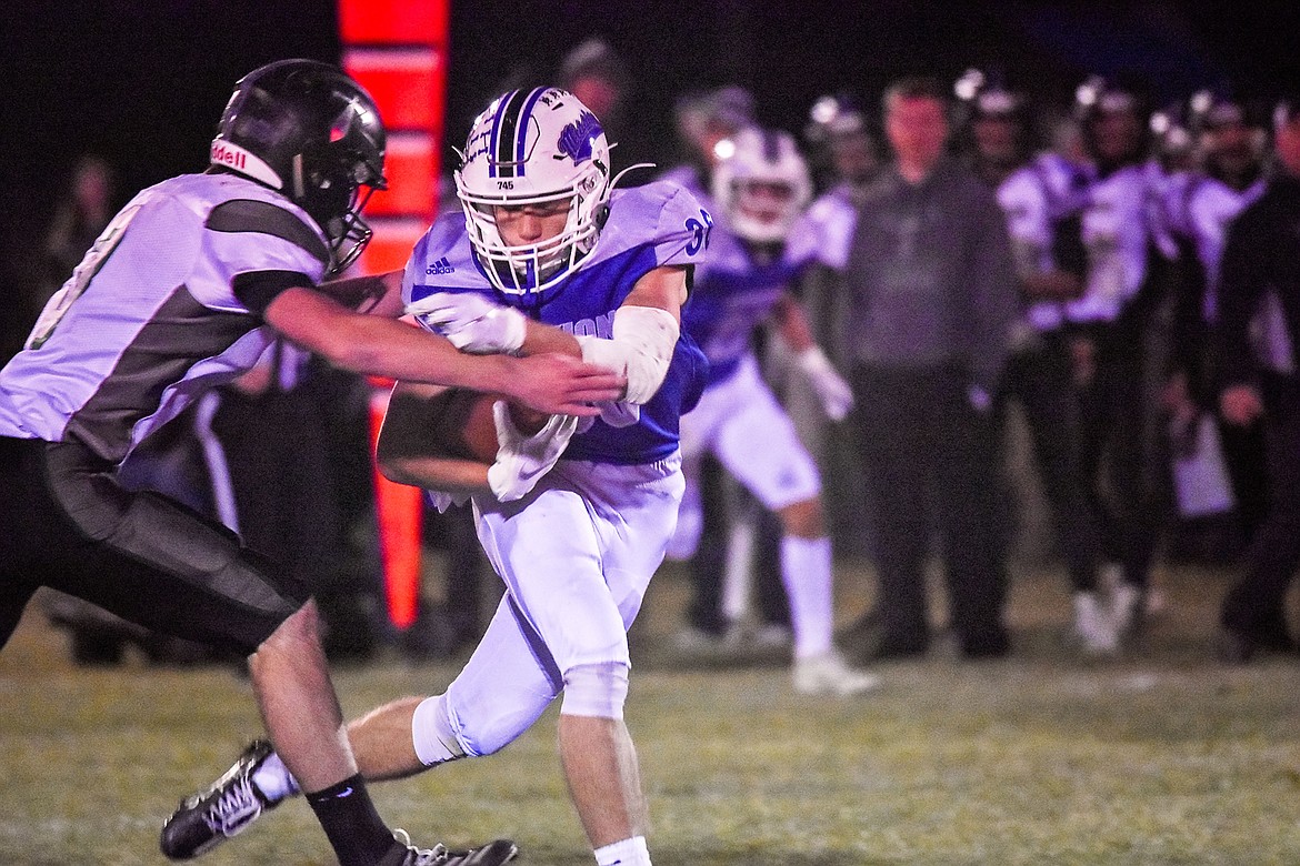 Mission Bulldog senior tight end Trance Bird advances the ball after a key reception during action between host Mission and the visiting Flint Creek Titans. (Photo courtesy of Christa Umphrey)