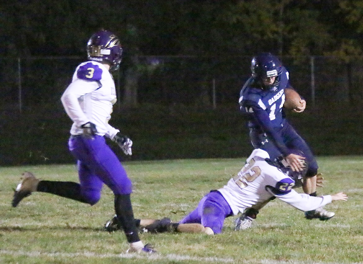 Senior Ty Bateman eludes a Wildcat tackler.