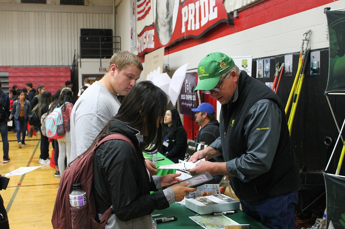 Rachal Pinkerton/Sun Tribune
A member of the RDO Equipment staff talks to students during the Othello Career Showcase.