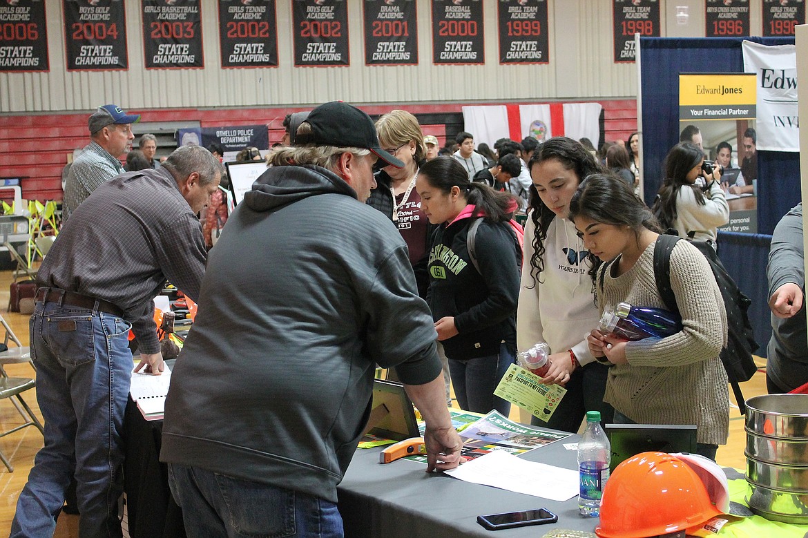 Rachal Pinkerton/Sun Tribune
Adams County employees talk to Othello High School students during the annual Othello Career Showcase on Thursday, Oct. 17.