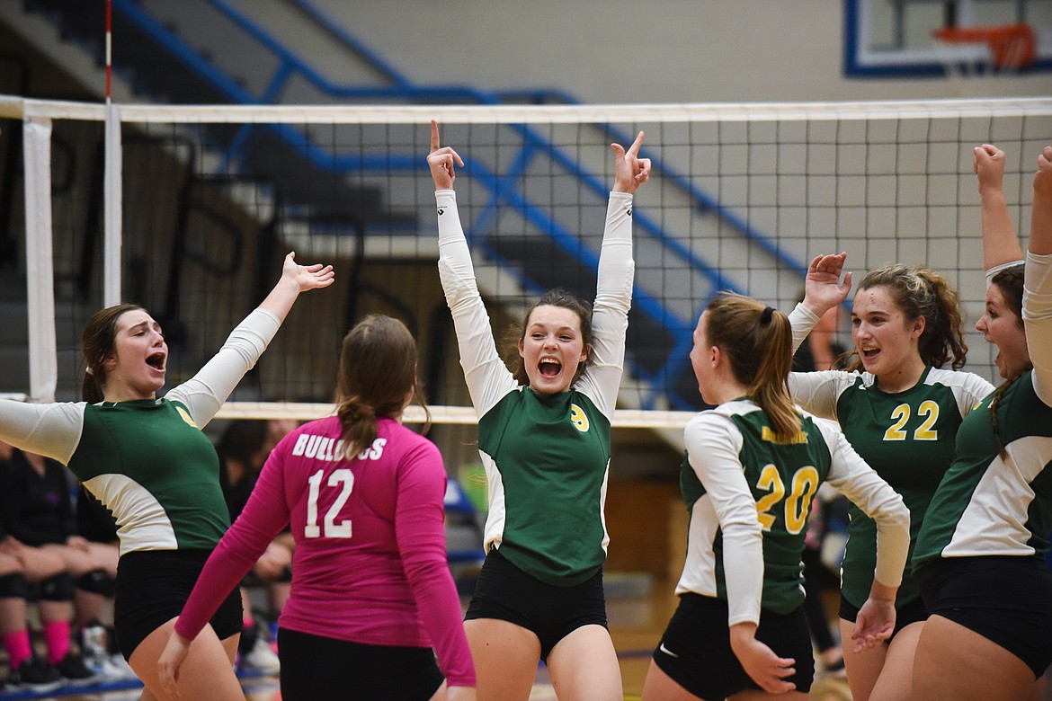 The Lady Dogs celebrate after a point against Columbia Falls on Tuesday. (Daniel McKay/Whitefish Pilot)