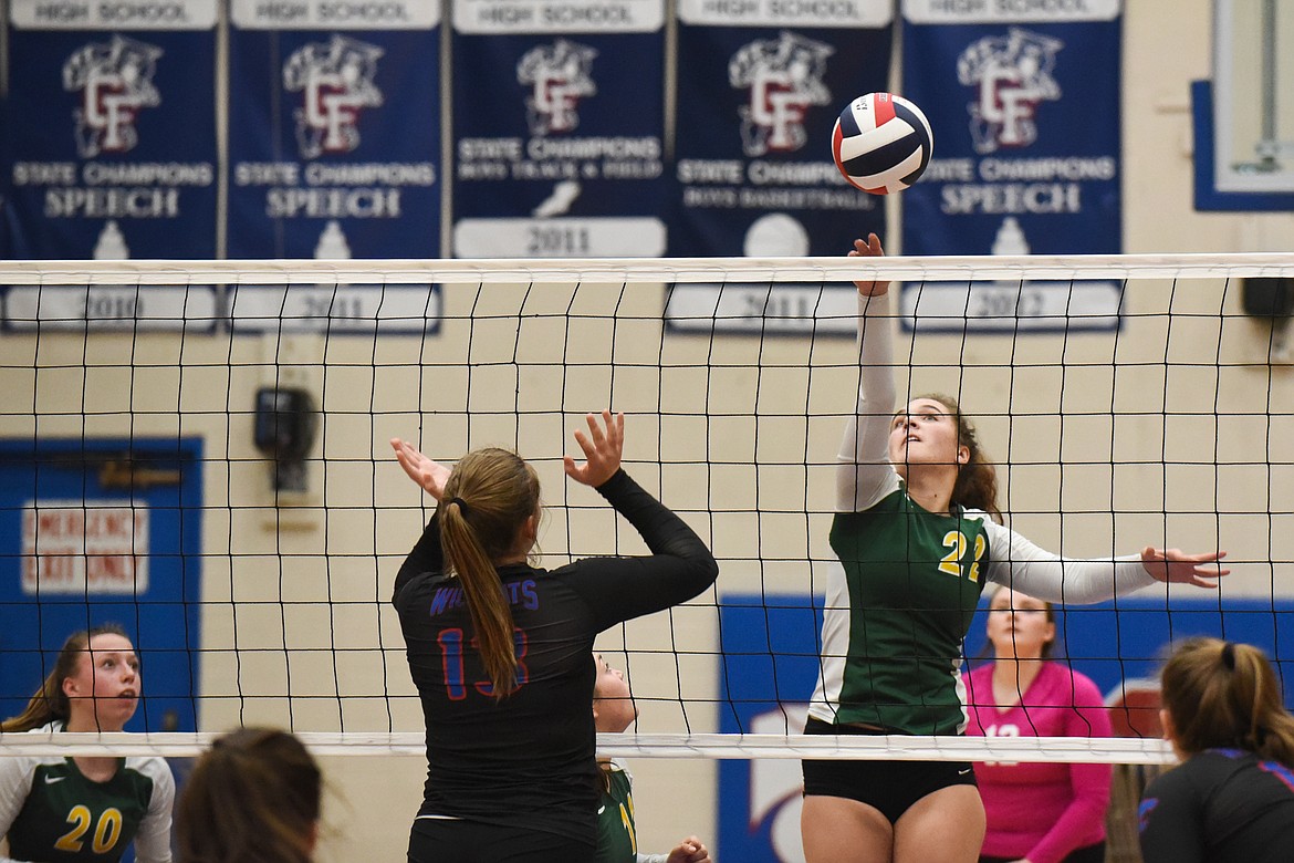 Payton Reisinger skies for the spike against Columbia Falls on Tuesday. (Daniel McKay/Whitefish Pilot)