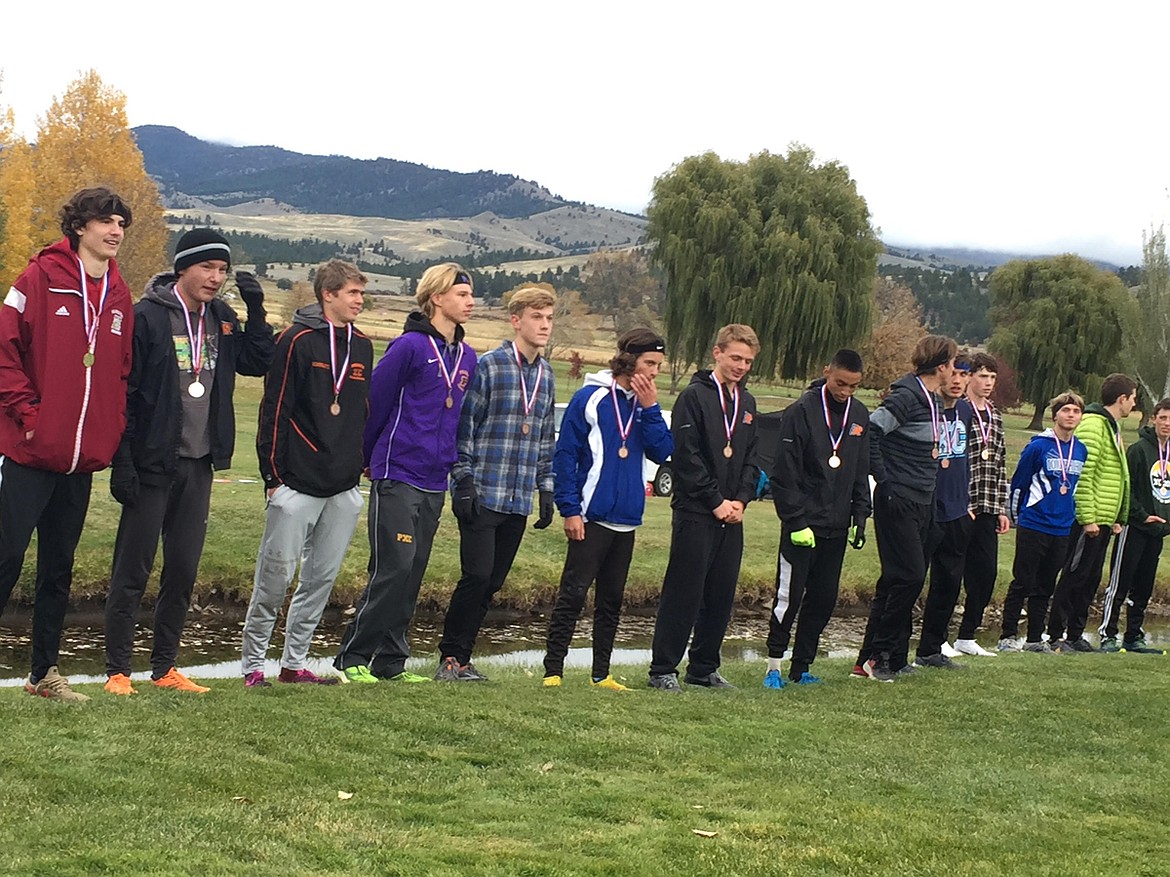 The 2019 Western A Classic cross-country top fifteen boys all-conference finishers pose for a photo op at the Hamilton golf course. Left to right in descending order: (1st) Colter Kirkland (Hamilton), (2nd) James Normandeau (Ronan), (3rd) Tyler Schmautz (Frenchtown), (4th) Mason Sloan (Polson), (5th) Aidan Jarvis (C-Falls), (6th) Will Flowers (Corvallis), (7th) Brant Heiner (Ronan), (8th) Michael Irvine (Ronan), (9th) James Role (C-Falls), (10th) James Petersen (C-Falls), (11th) Ben Steadman (Dillon), (12th) Seth Umbriaco (C-Falls), (13th) Bridger Gaertner (Whitefish), (14th) Miles Vrentas (Whitefish), (15th) Joe Lamb (C-Falls). Photo courtesy of Tyler Corum