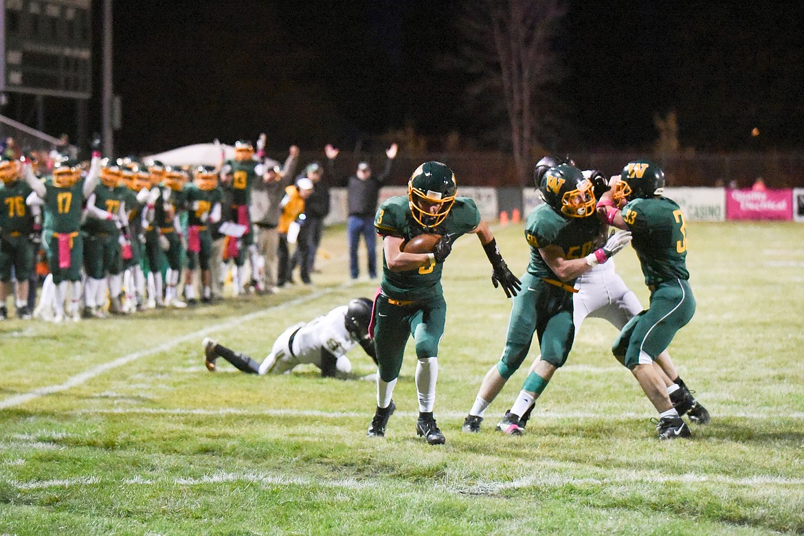 Jack Alton scores his first of two touchdowns against Stevensville. (Daniel McKay/Whitefish Pilot)