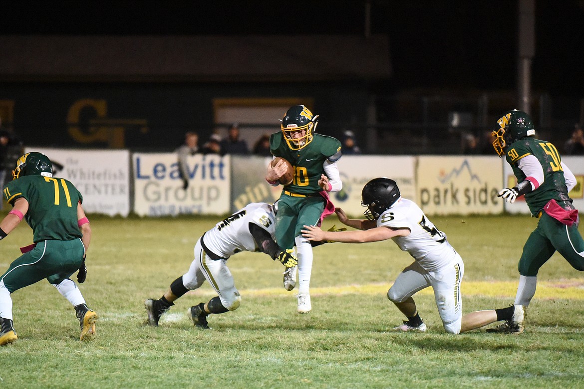 Fynn Ridgeway slips between two defenders during Friday&#146;s win over Stevensville. (Daniel McKay/Whitefish Pilot)