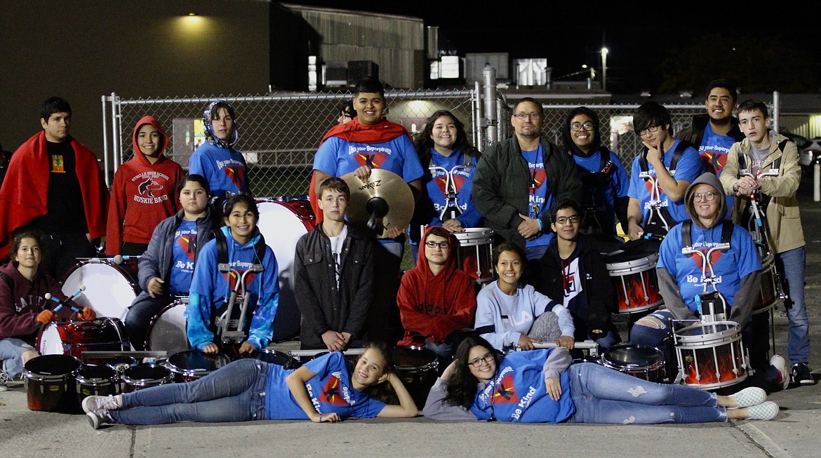 Casey McCarthy/Sun Tribune
Othello High School drumline members gather with their instructor, Will Lutey, to showcase their Kindness Shirts at halftime on Friday. The drumline had special performances in order to honor Kyle Lutey as part of Kindness Week.