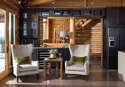 The remodeled log home kitchen features new flooring, lighting and cabinetry. (Photo courtesy of Ciao Design Group)