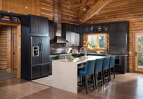 LES Barnabi of Ciao Design Group became the first Montanan honored by the Interior Design Society with his work on this Bigfork cabin. The remodeled log home kitchen displays the new counters and cabinetry. (Photo courtesy of Ciao Design Group)