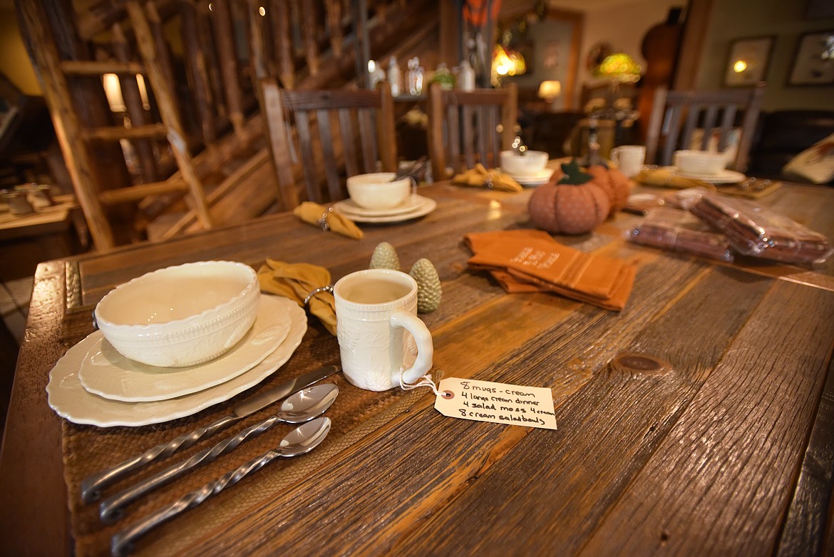 A dinner 
table on display at the LodgeCraft Furniture showroom in Somers.