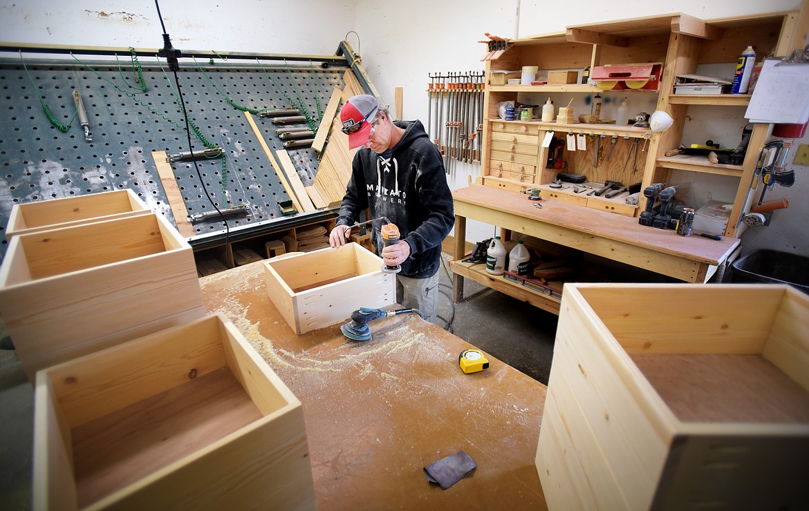 Dennis Gehrke sands drawers for a dresser at LodgeCraft Furniture in Somers.
(Brenda Ahearn/Daily Inter Lake)