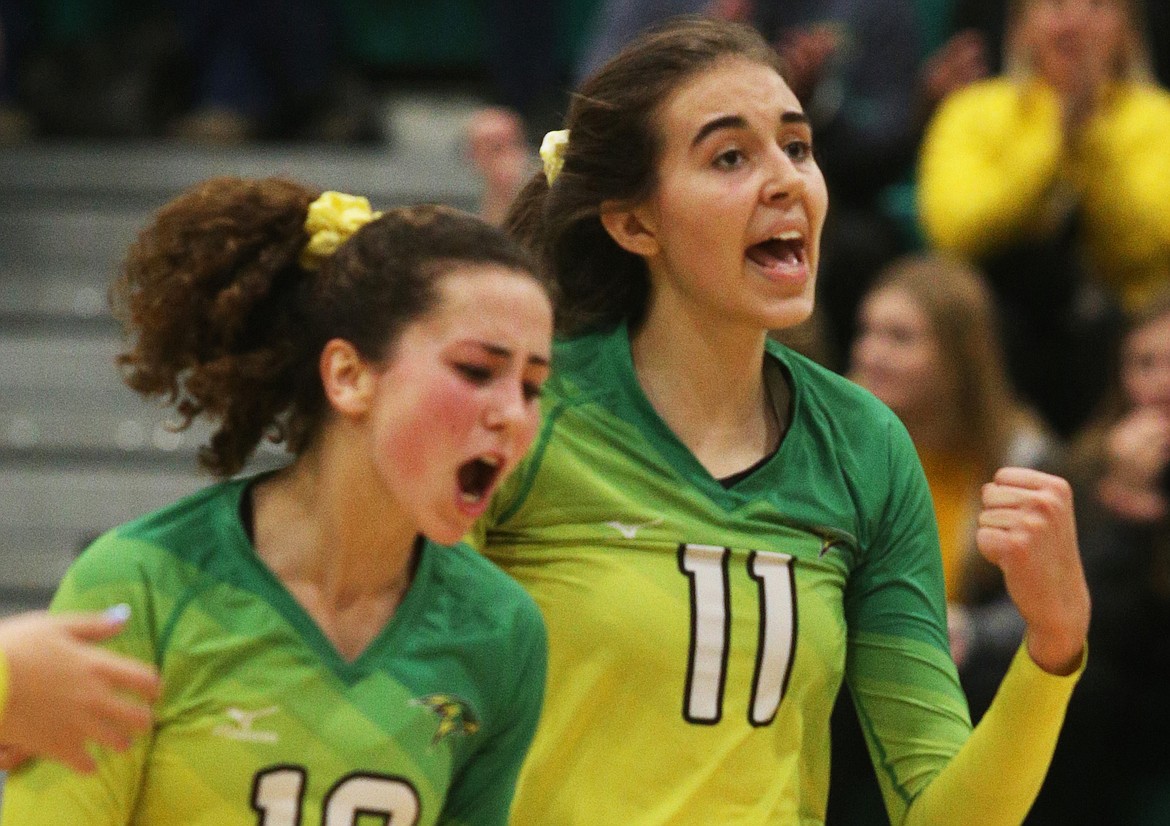 LOREN BENOIT/Press
Lakeland High&#146;s Katy Ryan (11) and Abigail Neff celebrate a point in the 4A Region 1 Championship game against Moscow on Oct. 24 at Lakeland High in Rathdrum.