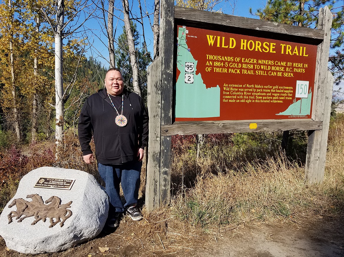 (Courtesy photo)
Gary Aitken Jr., Kootenai Tribe of Idaho chairman, stands next to the monument honoring the tribe for their contributions to early exploring in the Paradise Valley region of Boundary County.