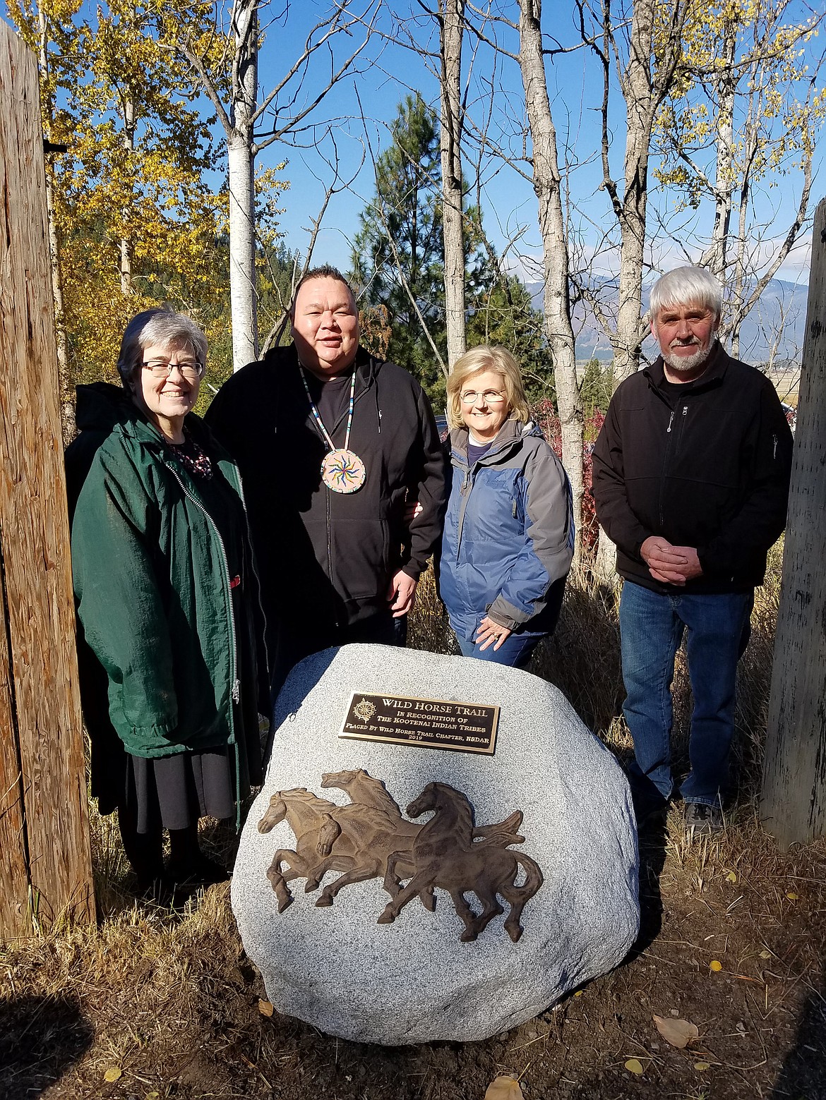 (Courtesy photo)
The Wild Horse Trail Chapter of the National Society Daughters of the American Revolution recently held a dedication ceremony Oct. 10 to honor the Kootenai (Ktunaxa) Indians for their contributions to early exploring in the Paradise Valley region of Boundary County. Pictured, from left, are Susan Cooke-Davis, chapter regent; Gary Aitken Jr., Kootenai Tribe of Idaho chairman; Susan Costa, Historic Preservation Committee chair; and Wally Cossairt, Boundary County commissioner.