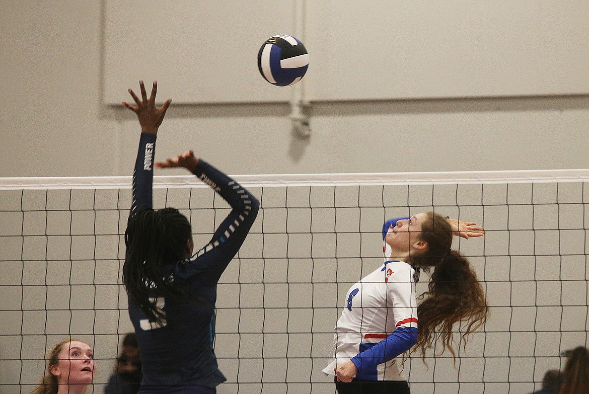 Coeur d&#146;Alene&#146;s Lili Hare goes for a spike as Lake City&#146;s Tanai Jenkins goes for the block in the 5A Region 1 title match last week.

LOREN BENOIT/Press