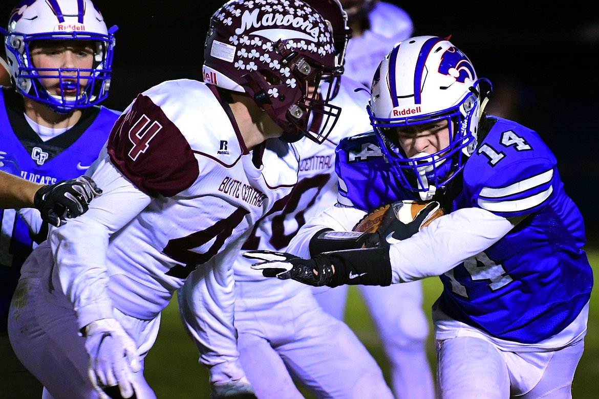 Taylor Bryan looks to get past Butte Central defender Thomas McGree in the second quarter Friday. (Jeremy Weber photo)