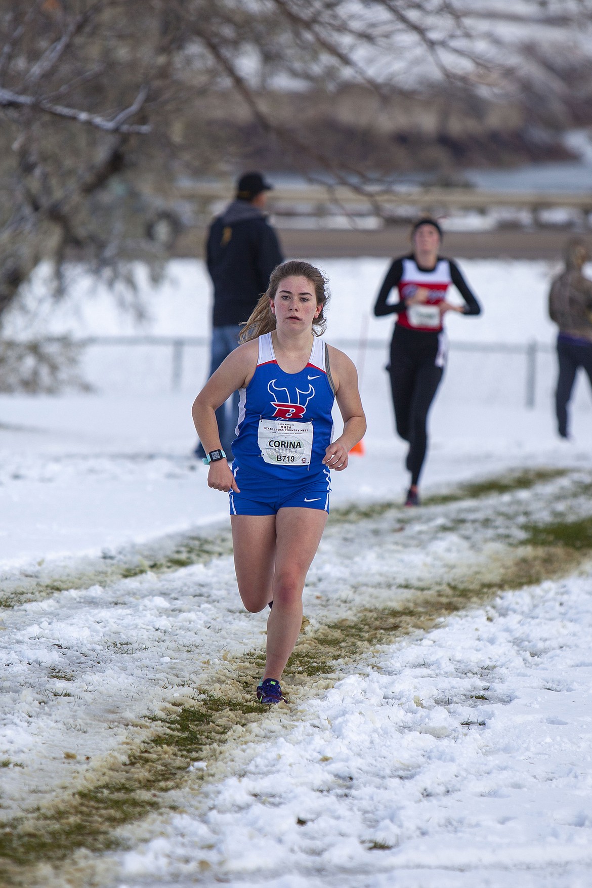 Bigfork senior Corina Wallace runs through chilly weather at the Eagle Falls Golf Course in Great Falls on Oct. 26. She finished the race in 22:59.43.  (Courtesy of Beau Wielkoszewski)