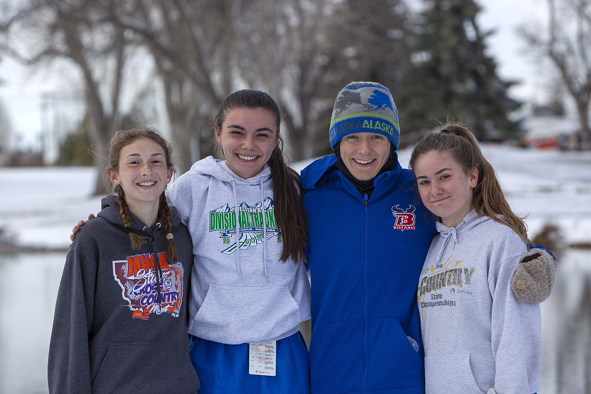Bigfork cross country seniors Kylie McMullen, Scout Jessop, Aiden Butterfield and Corina Wallace are all smiles in Great Falls. (Courtesy of Beau Wielkoszewski)