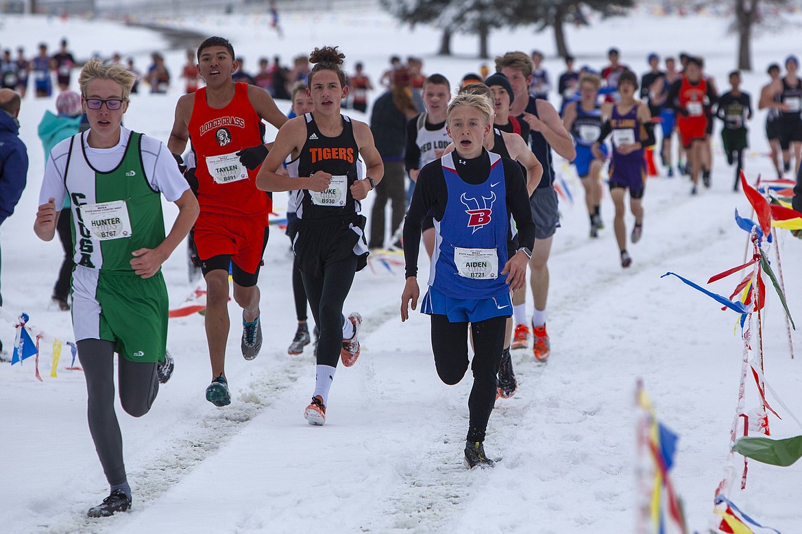 Senior Vikings runner, Aiden Butterfield races across snow-covered ground Oct. 26 in Great Falls during the Montana State Cross Country Championships at Eagle Falls Golf Course. Butterfield finished with a time of 18:42.97. (Courtesy of Beau Wielkoszewski)