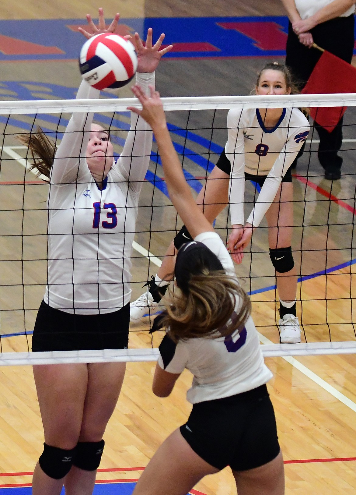 Grace Gedlaman goes up for a block in the second set against Polson Tuesday. (Jeremy Weber photo)