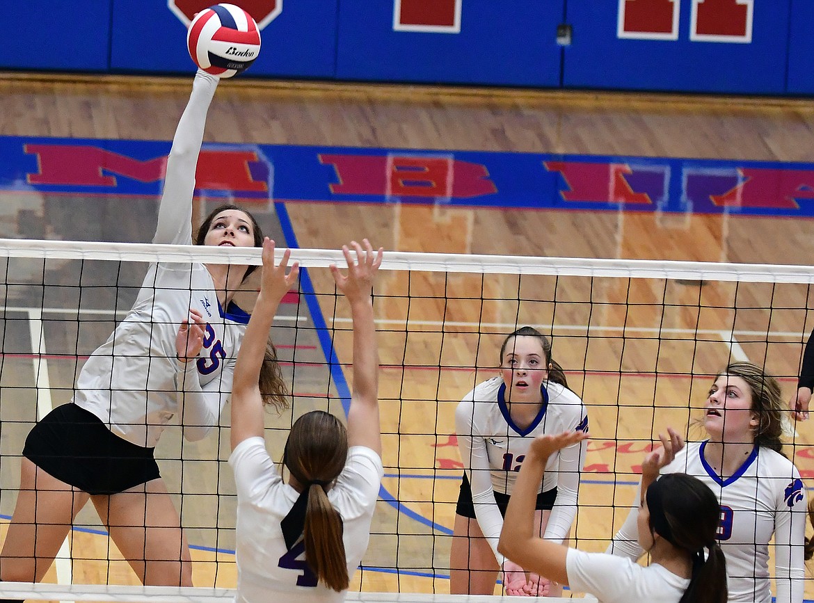 Kiera Brown goes high to attack the ball in the second set against Polson Tuesday. (Jeremy Weber photo)