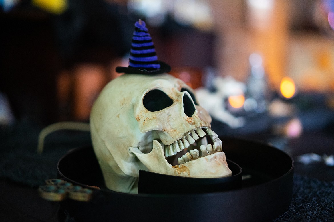 A spooky skull dons a witch&#146;s hat inside Stumptown Art Studio during the Whitefish Trick or Treat downtown on Thursday. (Daniel McKay/Whitefish Pilot)