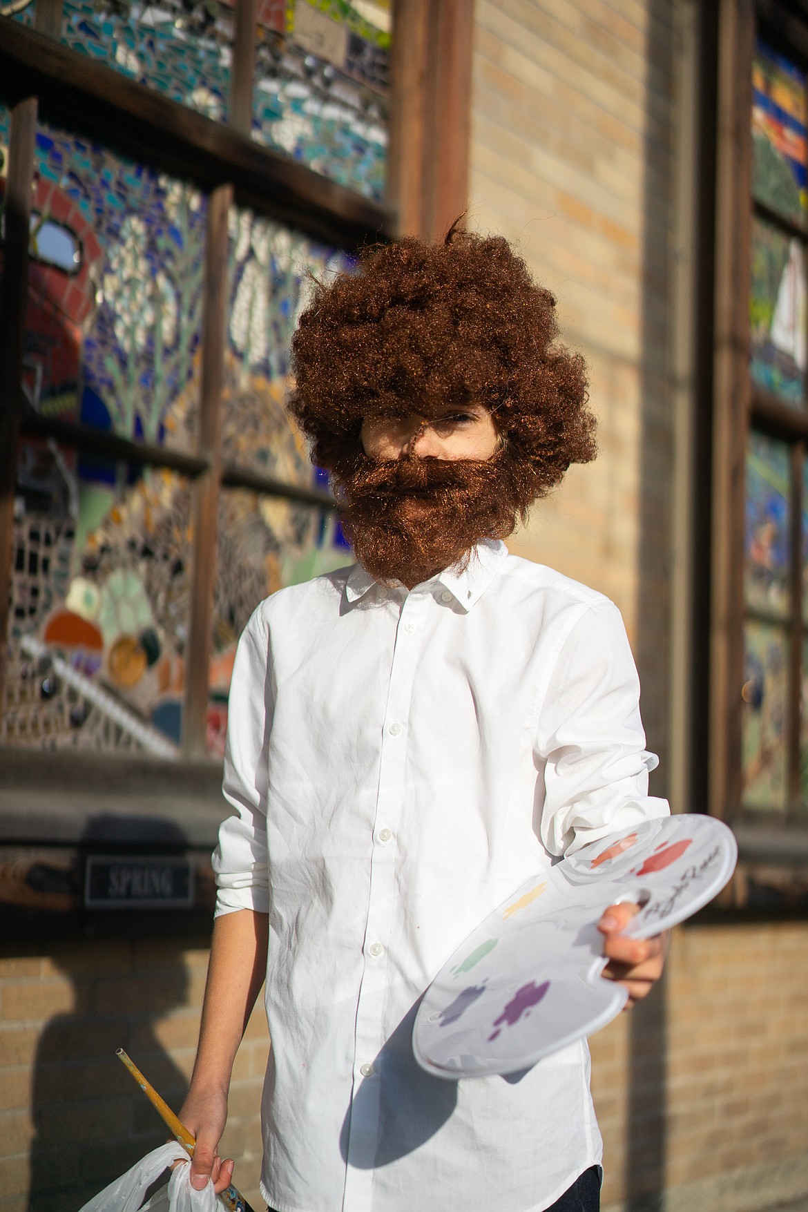 Bob Ross makes Central Avenue his canvas during the Whitefish Trick or Treat downtown on Thursday. (Daniel McKay/Whitefish Pilot)