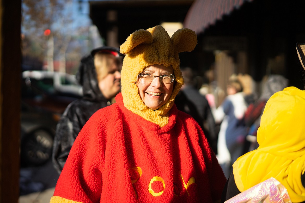 Winnie the Pooh smiles during the Whitefish Trick or Treat downtown on Thursday. (Daniel McKay/Whitefish Pilot)