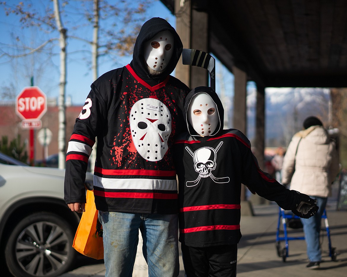 Not one, but two of Friday the 13th&#146;s Jason sneak around during the Whitefish Trick or Treat downtown on Thursday. (Daniel McKay/Whitefish Pilot)