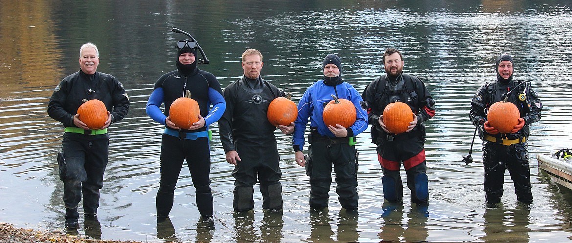 Photo by MANDI BATEMAN
The divers prepare to take on ther challenge of carving pumpkins underwater.