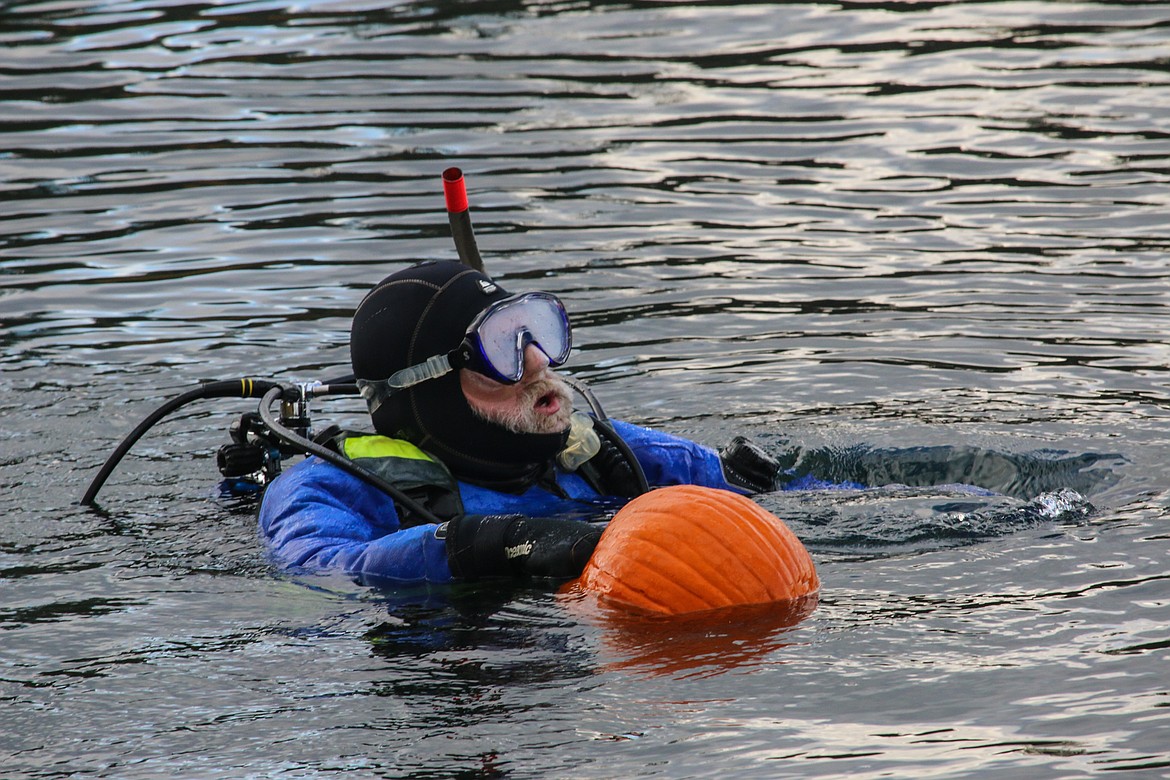 Photo by MANDI BATEMAN
The divers had to battle the buoyancy of the pumpkins in the water.