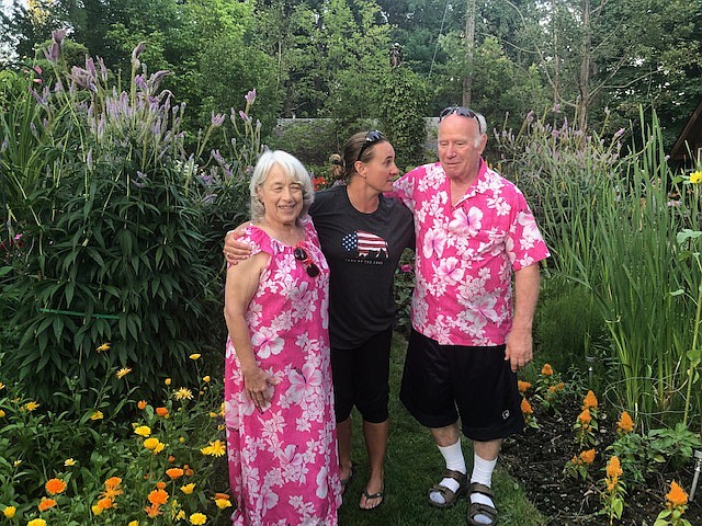 Claudia Moberg, after losing 85 pounds, and husband Don, who lost 55 pounds, at a garden party with personal trainer Julie Larrison (center) earlier this year. Claudia recently celebrated her 3rd year &#147;Gymaversity&#148; at Peak.