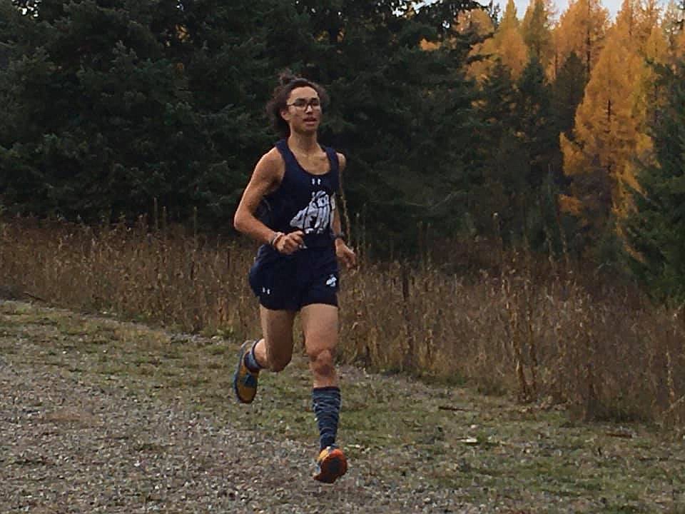 Photo by ELLEN SMITH
Levi Bonnell finishing eighteenth with a PR of 19:35.