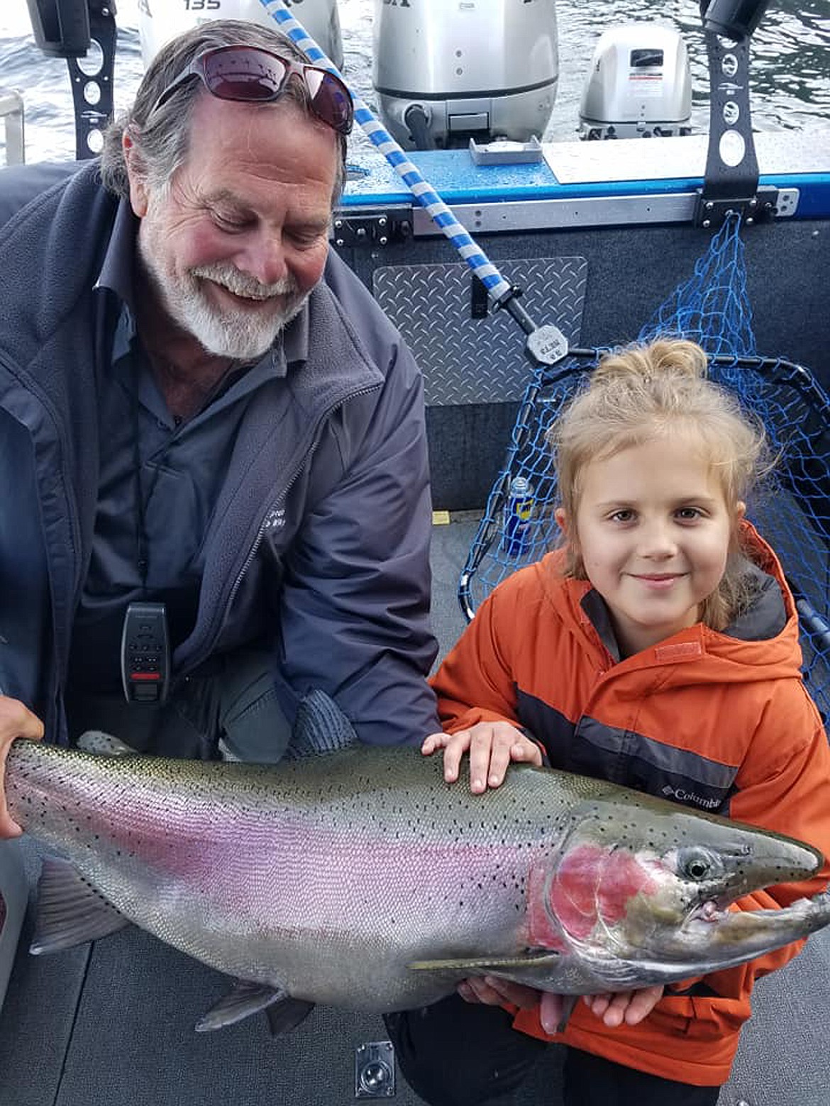 Photo courtesy BOB EGIZI
Sophie Egizi, 8, poses with Capt. Bob Wiley of Pend Oreille Charters after catching a 22.5-pound, 36.5-inch Gerrard trout that set a record for catch and release for the species.