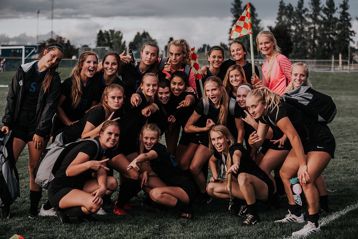 Photo by CHRISTINE WOELLER
The Coeur d&#146;Alene High girls soccer team poses for a photo after winning the consolation championship at the recent state tournament. The Viking girls also won the 5A girls sportsmanship award at the tourney. In the front row from left are Jordan Roth, Olivia Wyatt and Tierra Lambert; second row from left, Tate Hochberger, Molly Foster, Eleanor Morrisroe, Sophia Allan, Zoe Cox, Erin McPhee, Holly Hudson and Julieanna Stith; and back row from left, Geneva Bengtson, Kameron Fisbeck, Abigail Lyman, Myah Rietze, Lily Foster, Kelley Allen Lara, McKenzie Mattis, Autumn Lambert and Bailey Mongan. Not pictured is Maia Keith.
The following is from a press release submitted by the team: 
&#147;The CHS Viking Girls soccer team began their 2019 season with a retreat at Camp Lutherhaven. They spent time together on long, uphill trail runs, competing in paddle board races, and working together in the treetop challenge course. They built skills, confidence and camaraderie and set themselves up to navigate a season of ups and downs with grace and tenacity. Throughout the season they held strong to their mantra: Bleed Blue, which represents their team values- Team above self; Attitude reflects leadership; Celebrate successes; Embrace the challenge; and Be positive! When it came to districts and the state tournament, the bench never once sat down. They stayed on their feet cheering and encouraging teammates through hard losses and sweet sweet wins. Ending the season with the 5A Sportsmanship Award, the title of Consolation Champions and #4 in the state, while maintaining a cumulative GPA of 3.9, the CHS Viking Girls soccer team represented their school, our community and North Idaho well.  Congrats, Viks!&#148;
Said senior captain, Lily Foster: &#147;This season was different. Our focus was on team unity and working together.  We had team goals and put them ahead of personal goals and we played for each other.&#148;
Said captain Julieanna Stith, &#147;no matter where we were at in the game, winning or losing, we never gave up, until the last whistle blew.&#148;