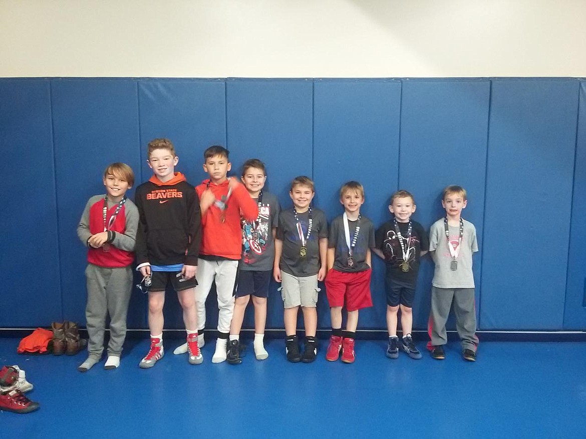 Courtesy photo
Buzzsaw Wrestling Club placers from a recent tournament in Bonners Ferry were, from left, Seth Fredrickson (3rd), Brock Armstrong (2nd), Colton McCliggot (3rd), Drake Paragamian (3rd), Brody Paragamian (1st), Caden Tucker (3rd), Edelbrock Garcia (1st) and Luke Hall (2nd).