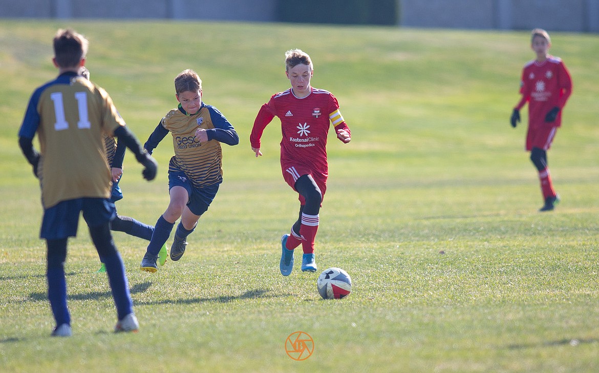 Photo courtesy BUSCEMA PHOTOGRAPHY
The Timbers North FC 06 Boys White soccer team traveled west to Pasco, Wash., to take on Tri-Cities FC B2006. An early second-half goal by Ari Rumpler, assisted by Grant Schofield, kept the Timbers leading most of the game, but Tri-Cities came back in the final moments to win it 2-1. Grant Schofield and Caleb Krell had multiple saves as goalkeeper. Timbers have a chance to close out the season in first place with a win or tie on Saturday in Spokane. Pictured is Logan Delbridge, right, of the Timbers.