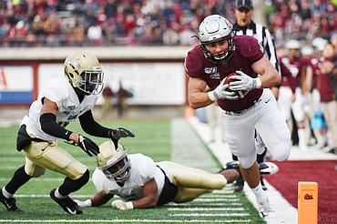 Montana running back Nick Ostmo (38) dives for the end zone on an 11-yard reception in the third quarter against Idaho at Washington-Grizzly Stadium on Saturday. Ostmo stepped out of bounds at the 5-yard line but ran in a 1-yard touchdown later in the drive. (Casey Kreider/Daily Inter Lake)